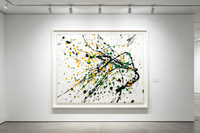 Abstract oil painting with green, orange-yellow and black dots scattered on light background