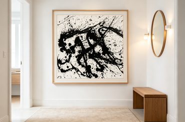 Abstract oil painting with black splashes and drips radiating across white canvas